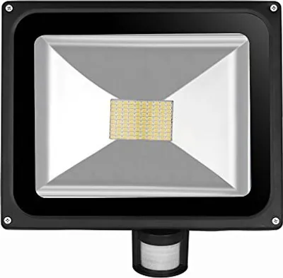A close-up, front-facing studio shot of a black LED floodlight with a motion sensor.