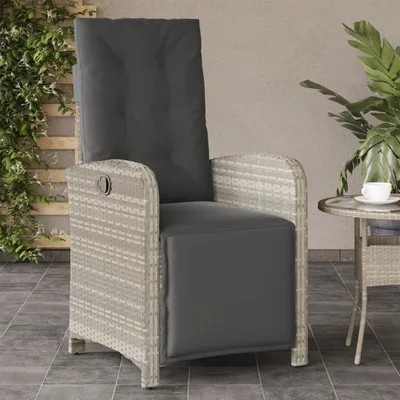 An outdoor patio scene with a rattan chair and a small side table.