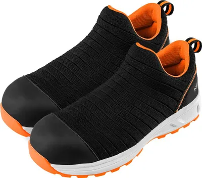 A pair of black slip-on work shoes with orange accents, presented on a white background.