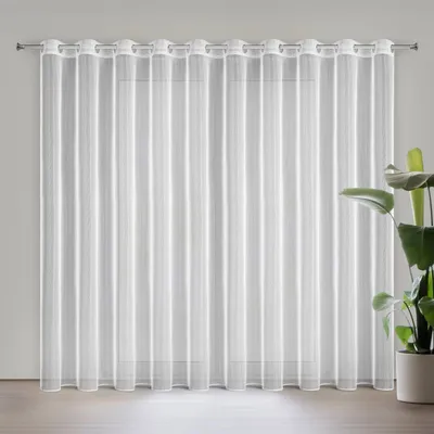 A white sheer curtain hanging on a rod in front of a window. A potted plant is visible to the right.