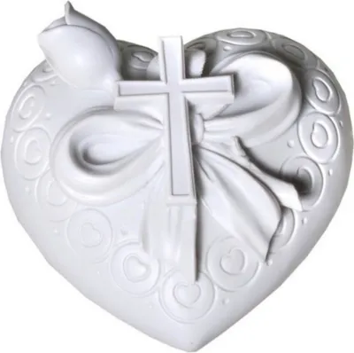 A white heart-shaped decorative item with a rose and a cross on it.