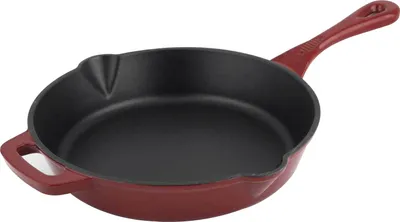 A red cast iron frying pan with a black interior, shown from a slightly elevated side angle against a white background.