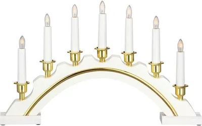 A white electric candle arch with gold accents and seven white candle-shaped lights.