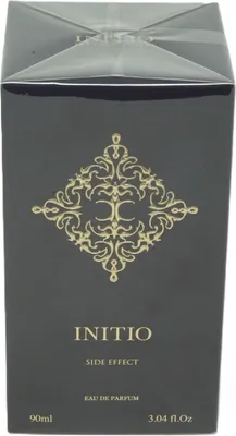 A black perfume box with gold ornate design and text.