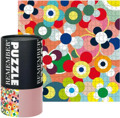 A product shot of a puzzle tube and the puzzle itself, with a colorful, abstract floral design.
