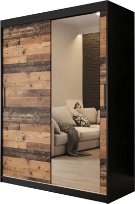 A sliding door wardrobe with a wood-effect front and a mirrored door, reflecting a living room interior.