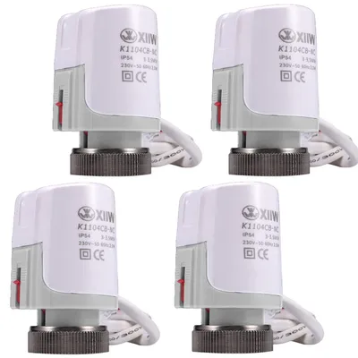 Four identical white and gray thermostatic radiator valves are arranged in a 2x2 grid against a white background.