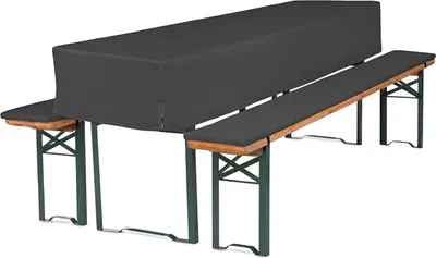 A picnic table and benches covered with a dark gray cover and cushions.