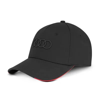 A black Audi baseball cap with the Audi rings logo on the front, shown from a side angle against a white background.