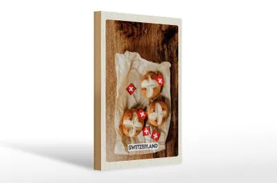 Produktbild von Holzschild Reise 20x30cm Schweiz Gerichte Laugenknoten