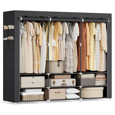 A fabric wardrobe with clothes hanging inside and storage boxes on the shelves.
