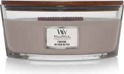 A WoodWick Fireside scented candle in a clear glass jar with a wooden lid.