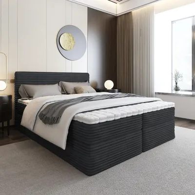 A bedroom scene with a large bed as the focal point, set against a modern, minimalist backdrop with subtle lighting.