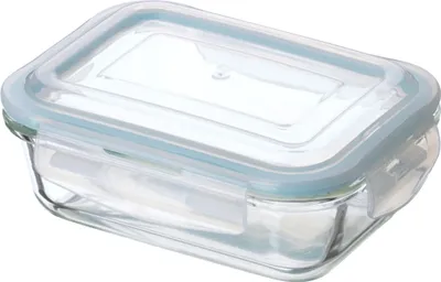 A clear, studio shot of a glass food storage container with a light blue lid.