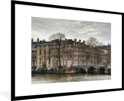 Produktbild von MuchoWow® Gerahmtes Poster Amsterdamer Gracht im Winter 90x60 cm - Poster mit Schwarzem Bilderrahmen Wandposter Rahmen Foto Bilder - Wanddekoration - Fotos