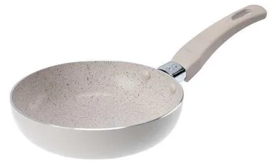 A frying pan with a speckled interior and a beige handle, shown against a white background.