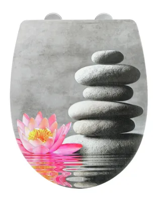 A toilet seat cover with a zen-like design featuring a stacked stone cairn and a pink water lily reflected in water.