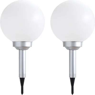 Two white globe-shaped solar garden lights with silver stems and black pointed ends for insertion into the ground, presented against a white background.