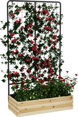 A wooden planter box with a metal trellis filled with red flowers and green foliage.