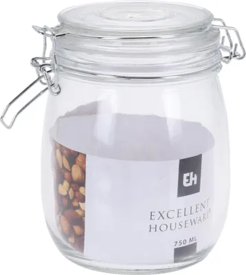 A clear glass jar with a metal clasp lid, filled with nuts and a label.