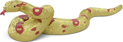 A golden snake figurine with red markings on a white background.