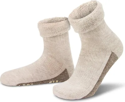 A pair of beige alpaca wool socks with brown accents and non-slip grips on the soles, presented on a white background.