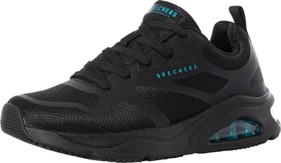 A studio shot of a single black sneaker.