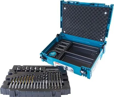 A teal and black tool case with various drill bits and accessories laid out.