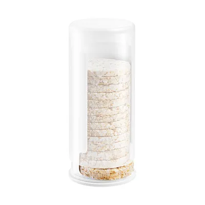 A stack of round rice cakes inside a clear plastic container with a white lid.