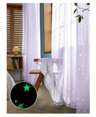 A bedroom scene with purple sheer curtains featuring glow-in-the-dark stars.