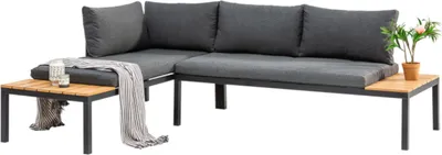 A modular outdoor seating group with dark gray cushions and a wooden tabletop on a side table.