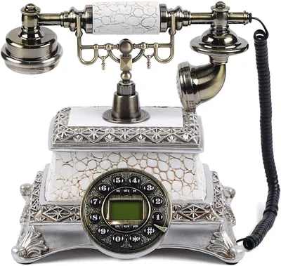 A vintage-style rotary dial telephone with ornate detailing.