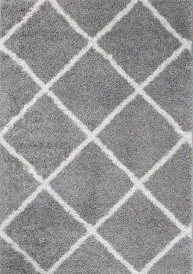 A close-up view of a gray rug with a white diamond pattern.
