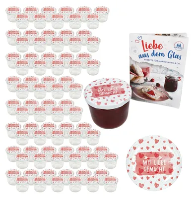 A collection of small jars with lids, a recipe book, and a single jar filled with jam, all decorated with hearts and the phrase 'Mit Liebe gemacht'.