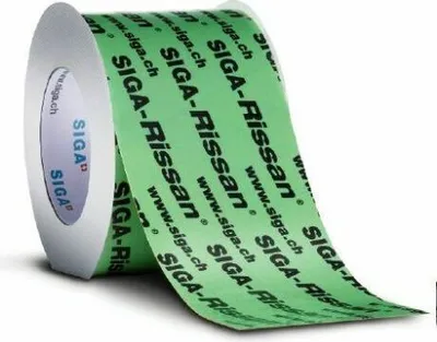 A roll of green tape with black lettering is shown on a white background.