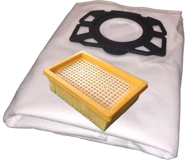 A vacuum cleaner bag and filter are laid out on a white background.
