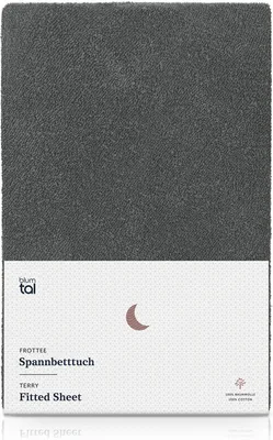 A folded fitted sheet with branding and product information.