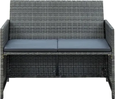 A gray poly rattan garden sofa with dark gray cushions, presented on a white background.