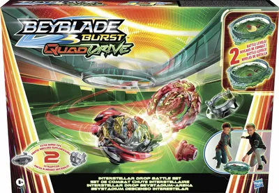 The image shows the packaging of a Beyblade Burst QuadDrive Interstellar Drop Battle Set, featuring two Beyblade toys in action and two children playing.