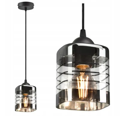 A pendant light fixture with a black cord and a glass shade with a black spiral design, shown from two different angles.
