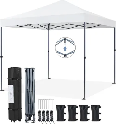 A white pop-up canopy tent is shown fully assembled, with its components laid out below. The components include a folded frame, a carrying bag, stakes, ropes, and sandbags.