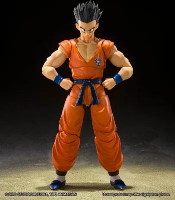 A full-body shot of an action figure of Yamcha from Dragon Ball Z, standing with hands on hips against a dark background.