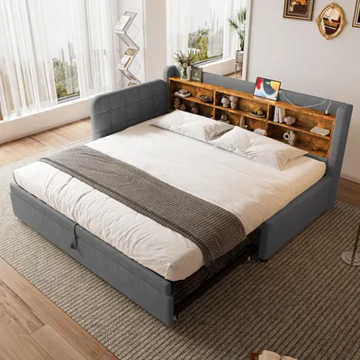 A bedroom scene featuring a gray upholstered daybed with a wooden shelf headboard.
