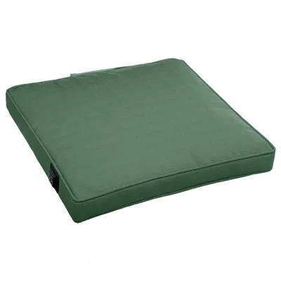 A green outdoor seat cushion is shown against a white background.