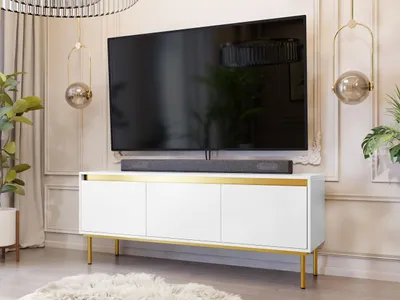 A modern living room with a TV and media console.