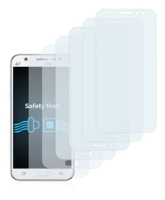 A smartphone with multiple screen protectors fanned out behind it.