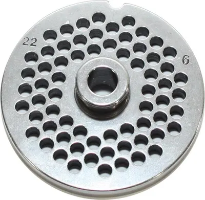 A close-up, top-down view of a metal grinder plate with many holes.