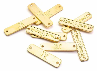 Produktbild von Vintageparts Verbinder Aufnäher Handmade Aufschrift goldfarben 10 Stück