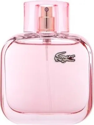 A pink perfume bottle with a gold spray nozzle and a crocodile logo.