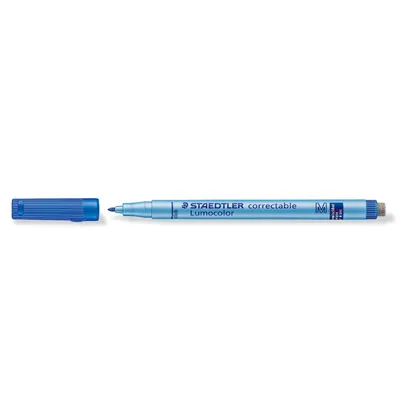 A blue Staedtler Lumocolor correctable marker with its cap off, placed to the left of the marker.